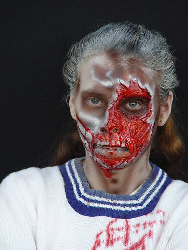  Zac applies make-up to a street zombie 